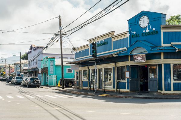 A street corner with colorful buildings, including a blue one named 